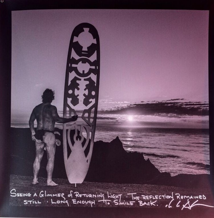 de la Haba holding his surf board in Montauk 