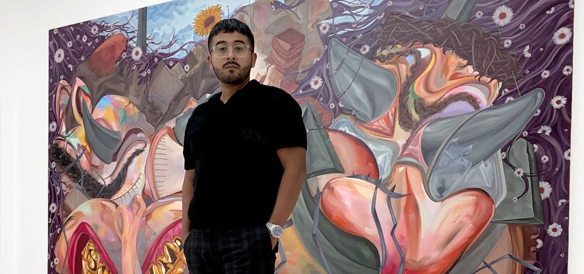 Jose Zuniga in front of one of his large paintings